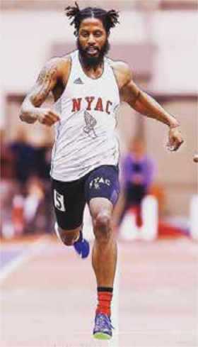 Man running indoor track field