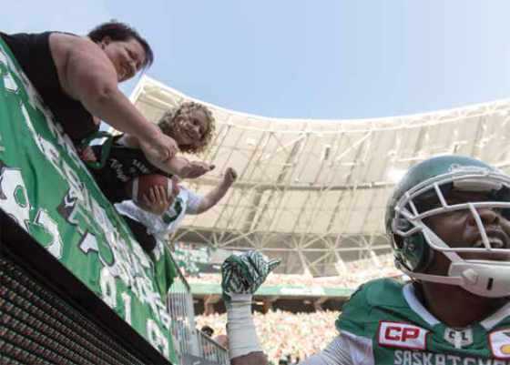 Paige Hansen cheering for Duran Carter on the sidelines