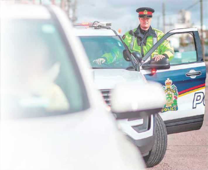 Saskatoon police officer getting into vehicle
