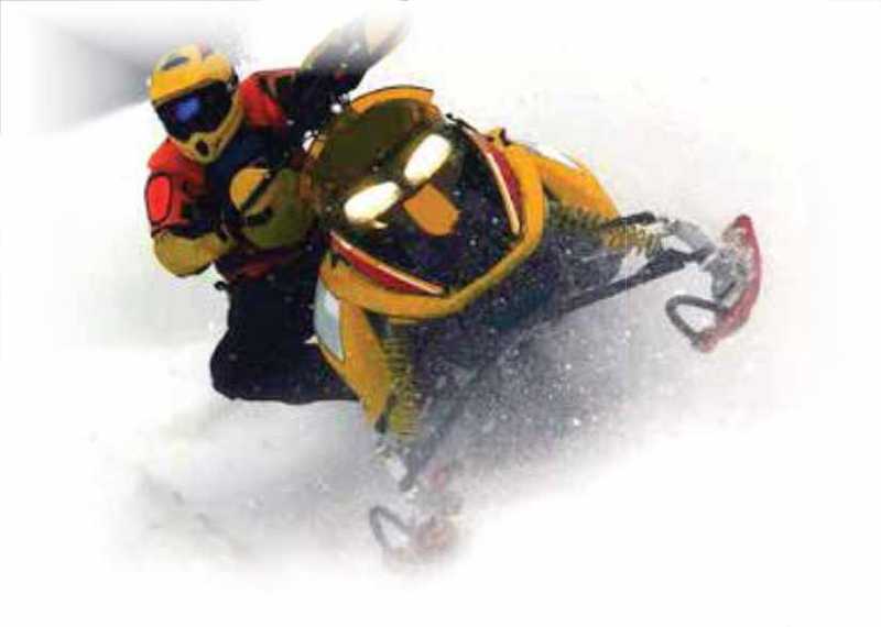 Snowmobiler wearing safety equipment on a snomobile
