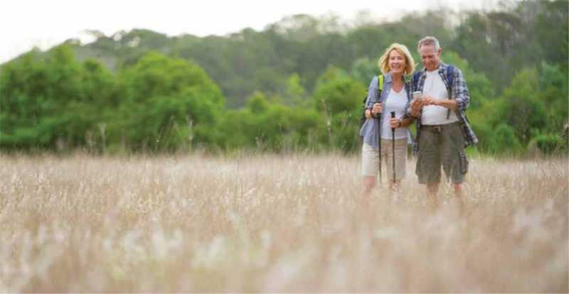 Hikers hiking with polls in Saskatchewan Grasslands