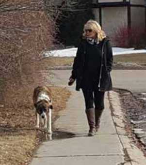 Penny Germain is walking her dog Otis, the friendly Great Pyrenees Border Collie cross rescue dog