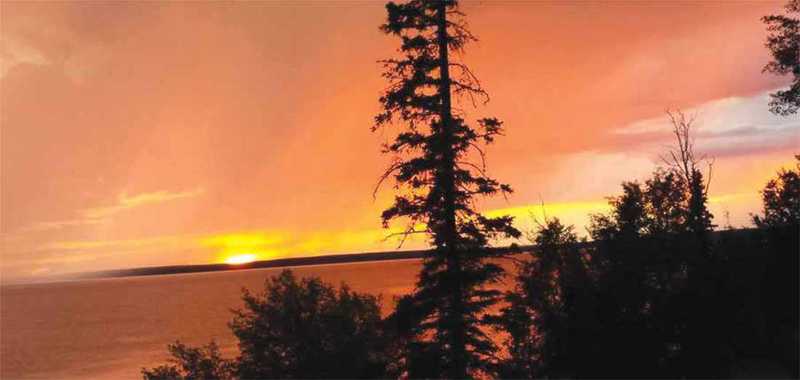 Sunrise over lake in Waskesiu Saskatchewan